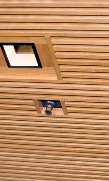 wooden ceiling with vent and fire sprinkler