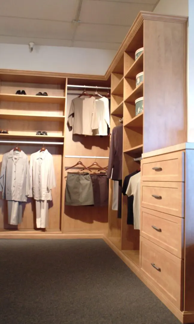 light wooden closets and cabinets with clothes